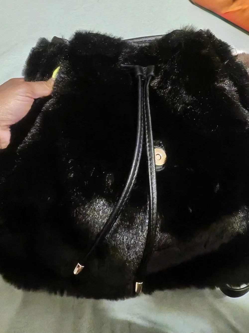 Juicy Couture Dreamy Divas black faux fur backpack with drawstring closure